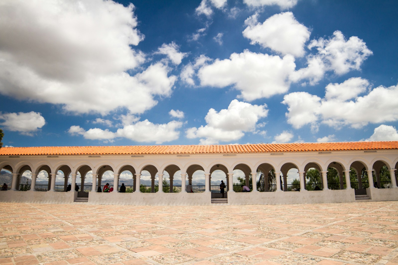 Arched colonnade representing stability and real estate heritage