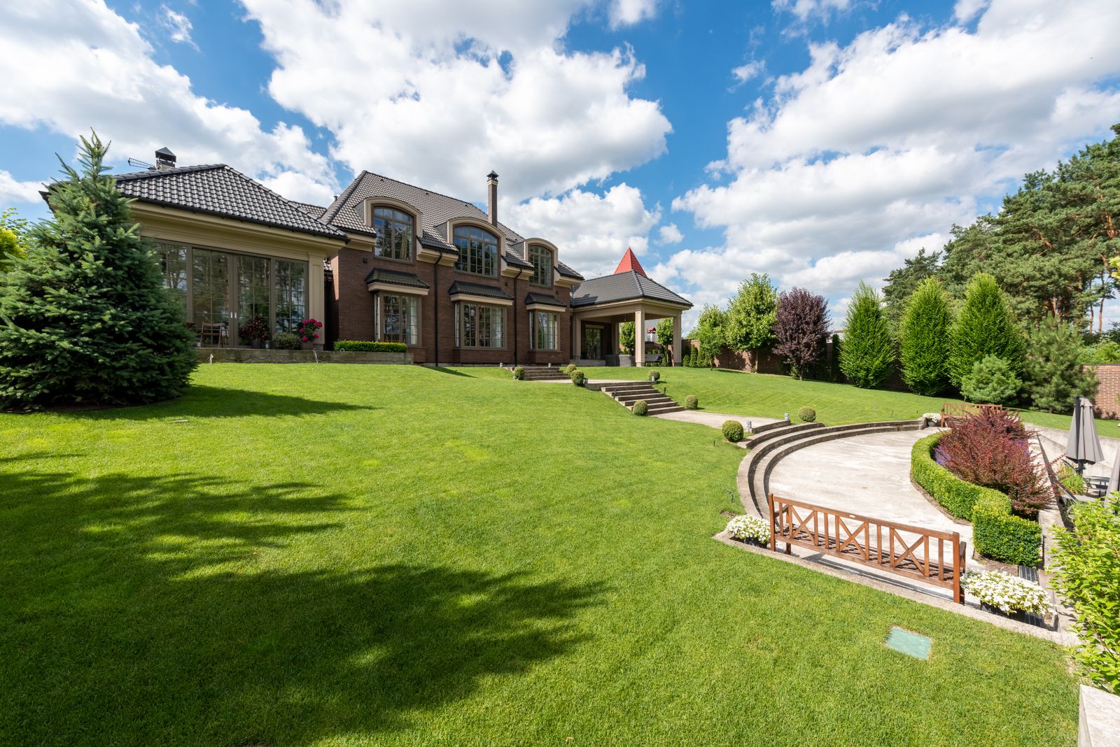 Historic brick mansion representing high-end real estate assets